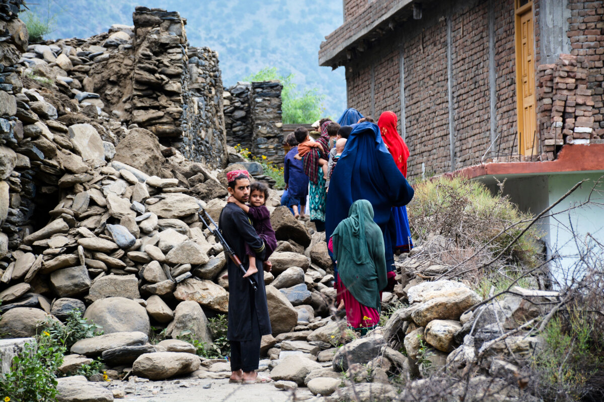 Local residents walk by a house destroyed by an earthquake that killed many people and destroyed villages in eastern Afghanistan, in Mazar Dara, Kunar province, Afghanistan, on Sept. 1, 2025. (Wahidullah Kakar/AP Photo)