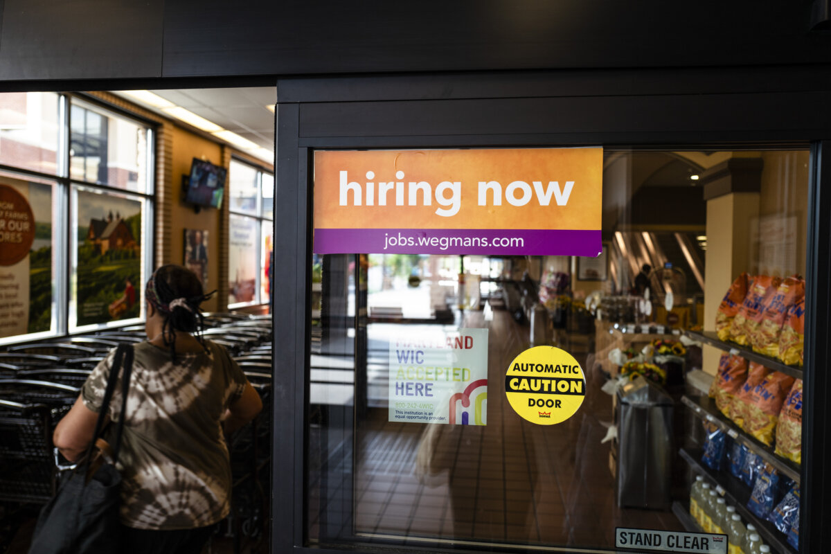 Hiring ad displayed at a store in Columbia, Md. on July 21, 2025. (Madalina Kilroy/The Epoch Times)