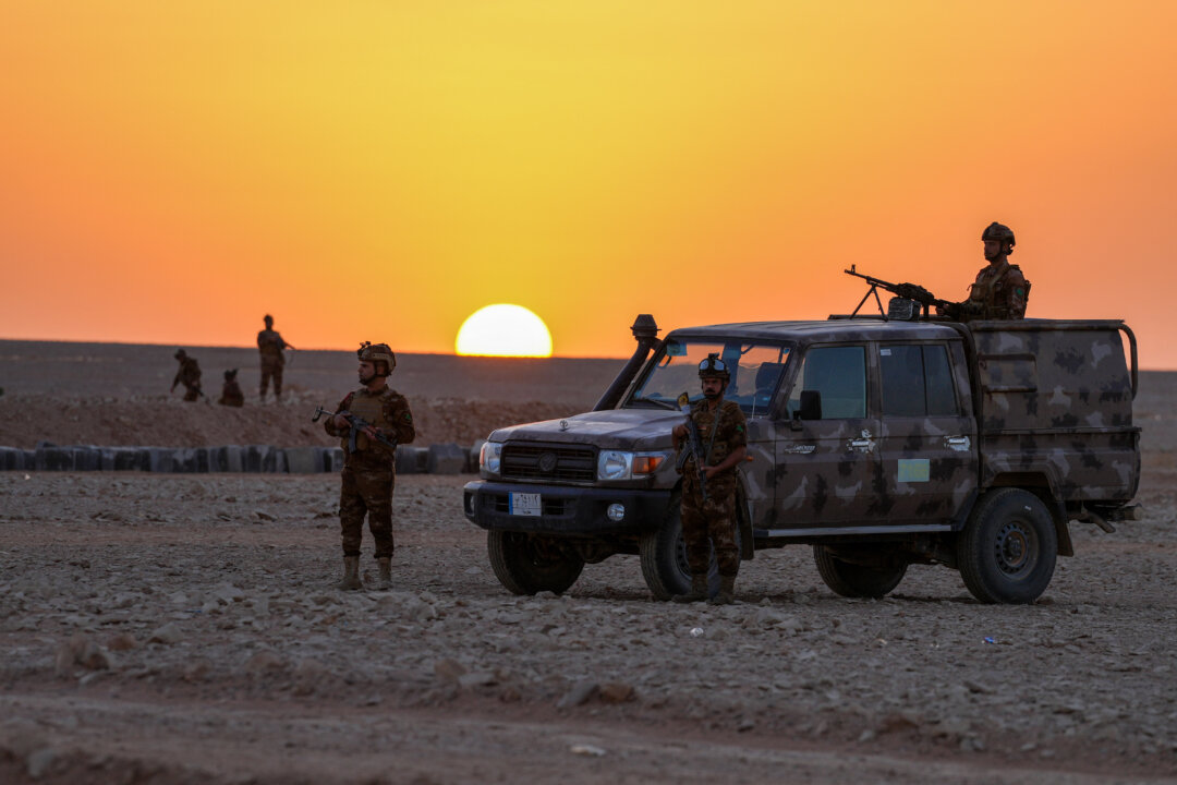 NextImg:Day in Photos: Iraqi Army Patrols Border, France Returns Skulls to Madagascar, and Giant Landfill in Indonesia