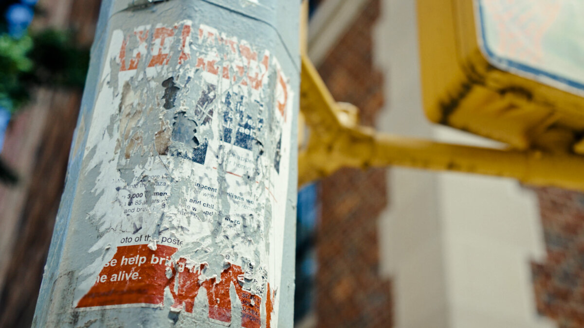 Defaced posters of Gaza hostages in New York City featured in "Torn." (Nim Shapira)