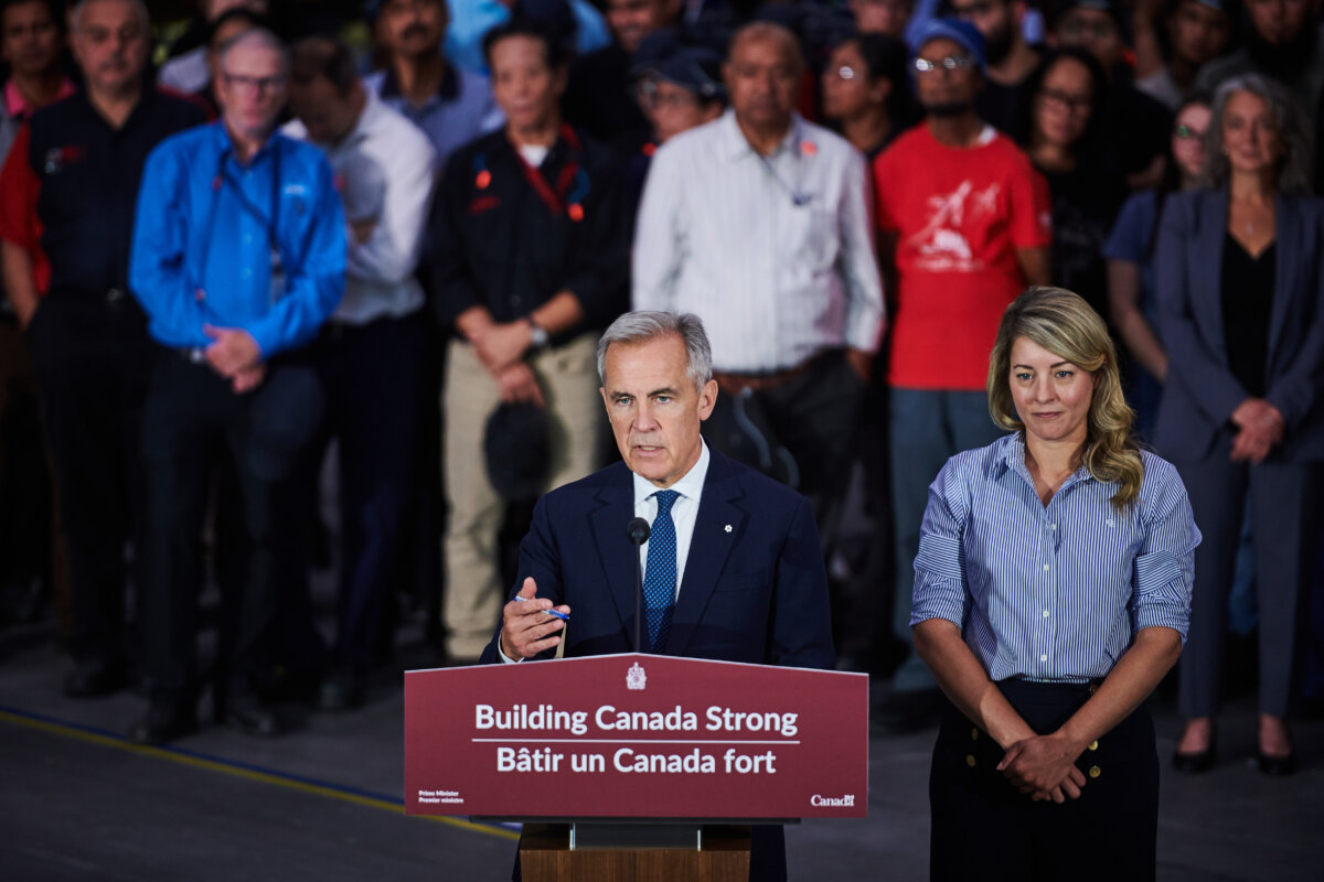 Prime Minister Mark Carney speaks at a press conference as he is joined by Industry Minister Mélanie Joly at a manufacturing facility in Mississauga, Ont., on Sept. 5, 2025. (THE CANADIAN PRESS/Sammy Kogan)