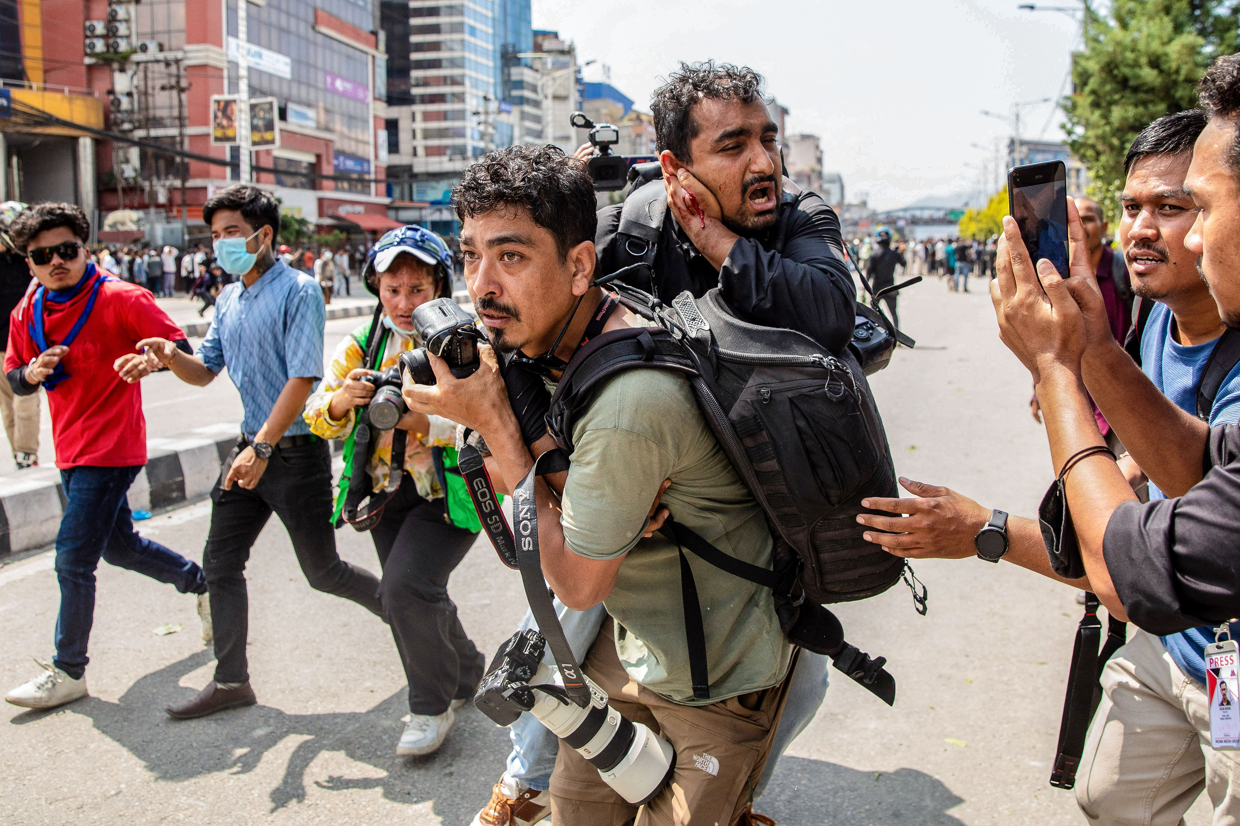 Day in Photos: Protests in Nepal, Shooting in Jerusalem, and Total Lunar Eclipse