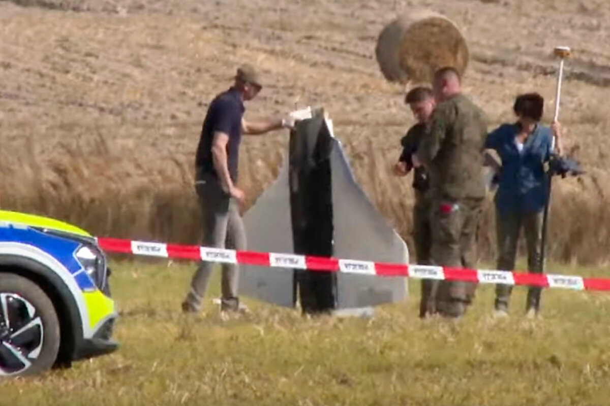 Police and military police secure parts of a damaged object shot down by Polish authorities at a site in Wohyn, Poland, on Sept. 10, 2025. (Rafal Niedzielski/AP Photo)