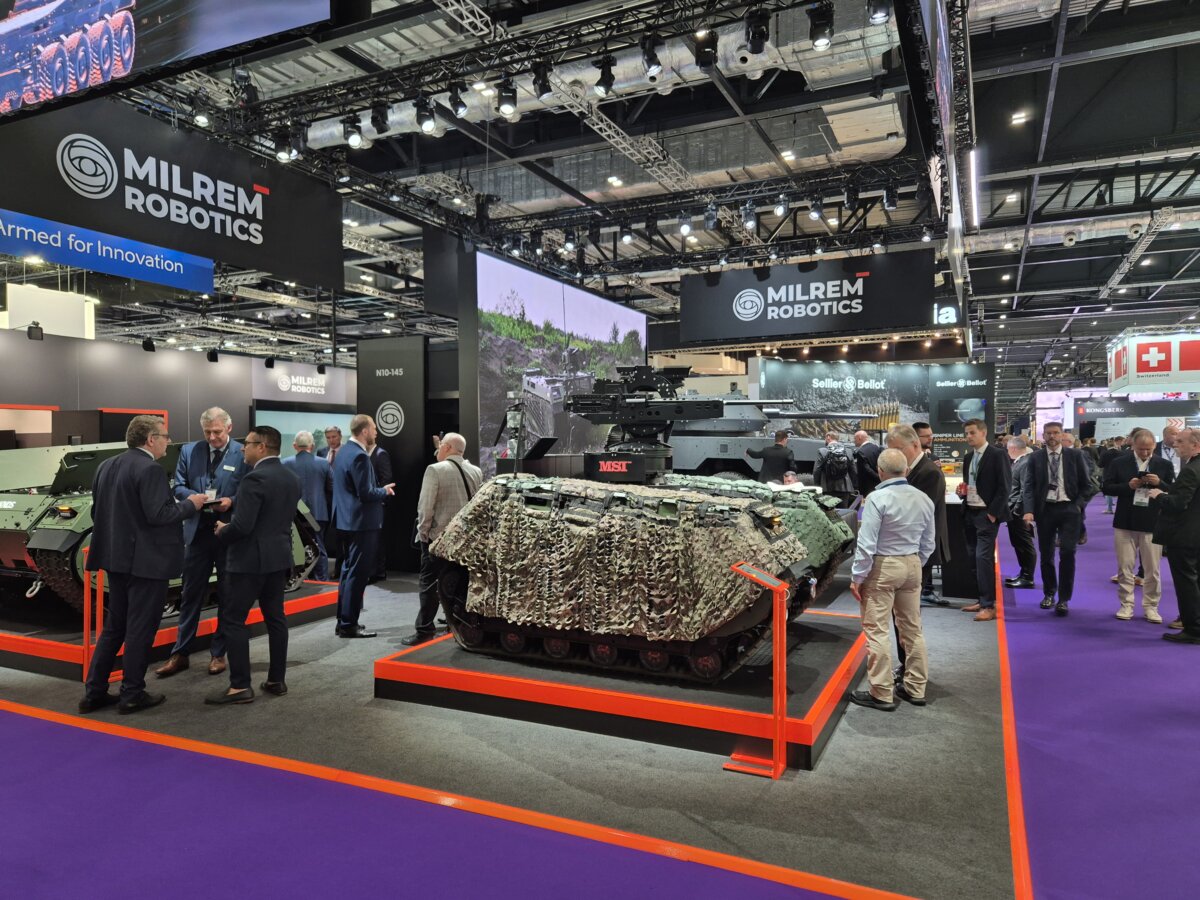 People look at autonomous vehicles at Estonian company Milrem Robotics' stand at Defense and Security Equipment International exhibition at ExCel in London on Sept. 10, 2025. (Chris Summers/The Epoch Times)