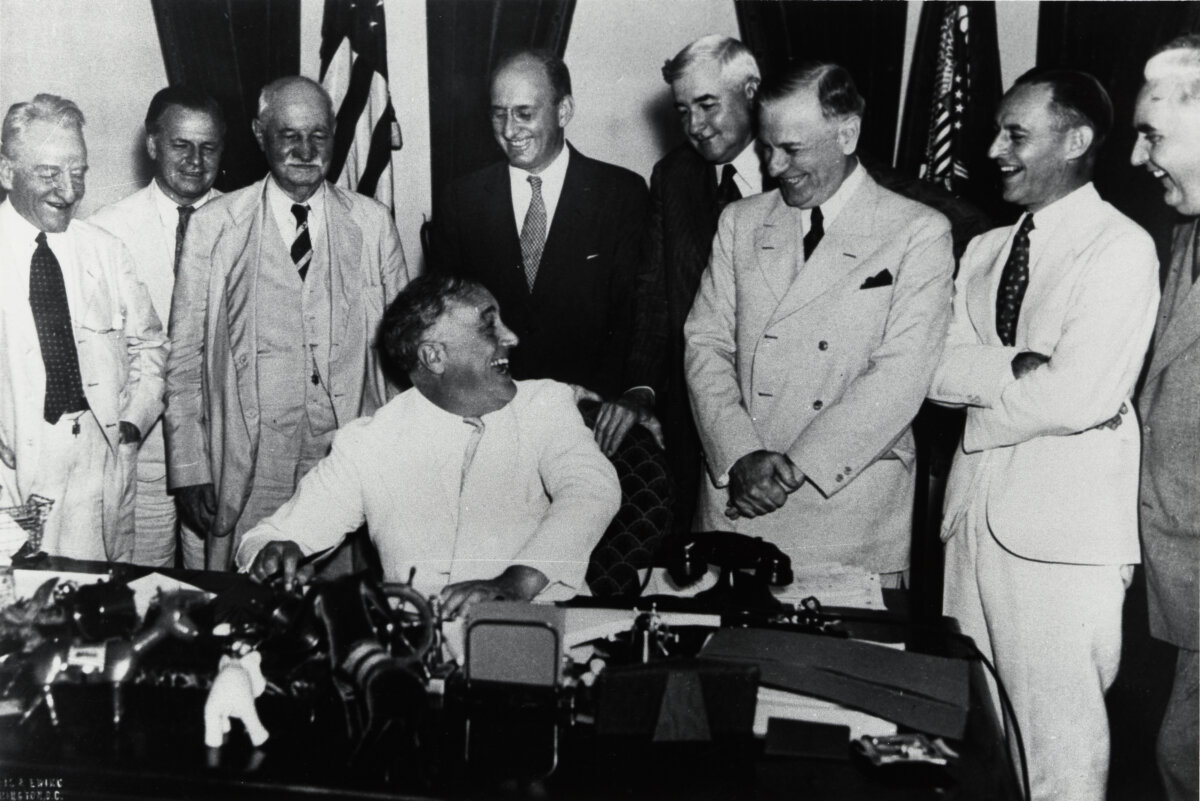President Franklin Delano Roosevelt signs the Banking Act of 1935. (Public Domain)