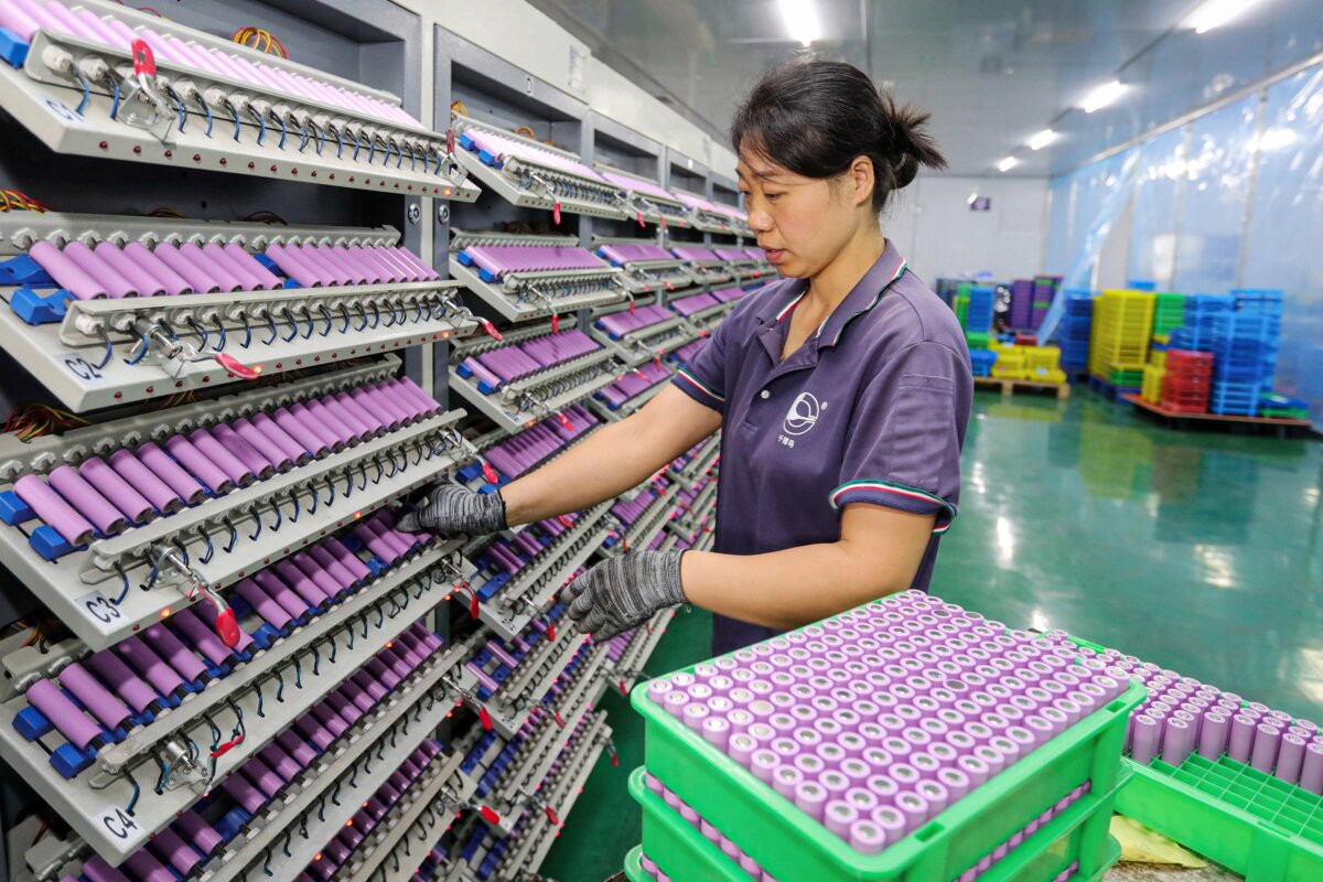 An employee works at a company manufacturing lithium batteries in Huaibei, Anhui Province, China, on Nov. 26, 2024. (STR/AFP via Getty Images)