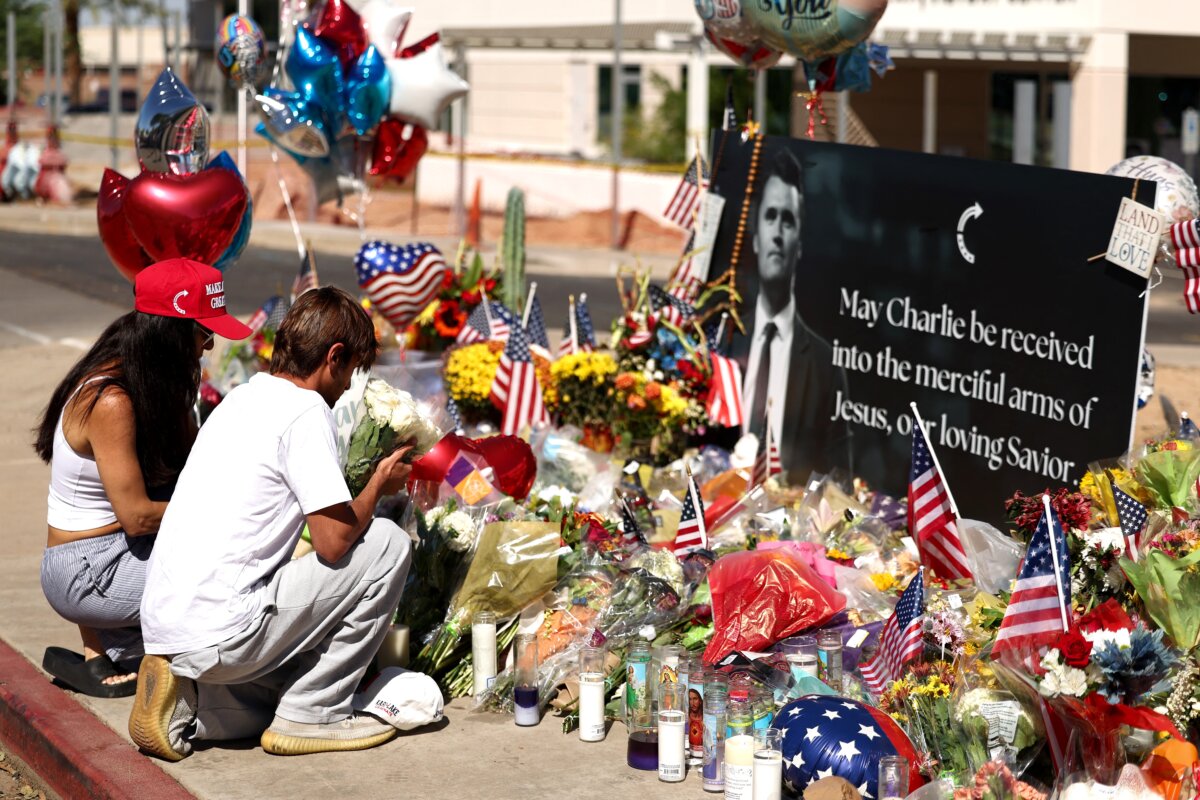 Mourners visit a memorial for Charlie Kirk outside of the Turning Point USA headquarters in Phoenix, Ariz., on Sept. 12, 2025. (Charly Triballeau/AFP)