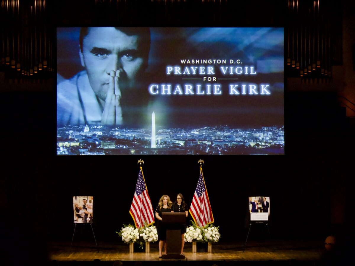 Charlotte Perez and Malia Shirley, Turning Points USA officials, deliver opening remarks at a prayer vigil for Charlie Kirk at the John F. Kennedy Center in Washington on Sept. 14, 2025. (Travis Gillmore/The Epoch Times)