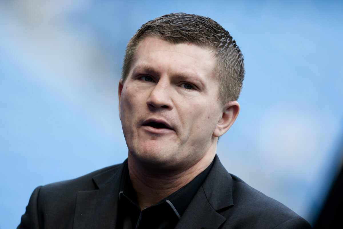 Boxer Ricky Hatton stands by the pitch before Manchester City's English Premier League soccer match against Manchester United at the Etihad Stadium, Manchester, England, on Sept. 22, 2013. (Jon Super/AP Photo)