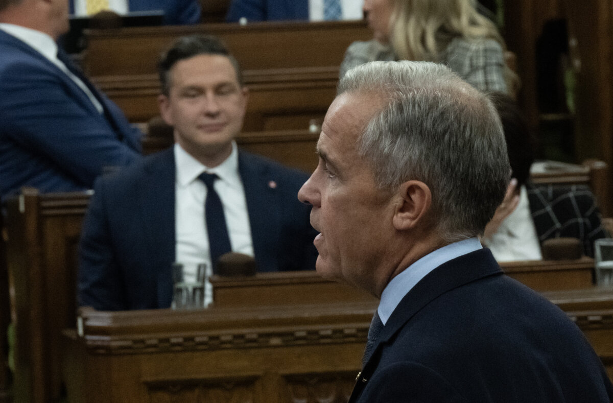 Prime Minister Mark Carney rises during question period on Parliament Hill in Ottawa on Sept. 15, 2025. (The Canadian Press/Adrian Wyld)