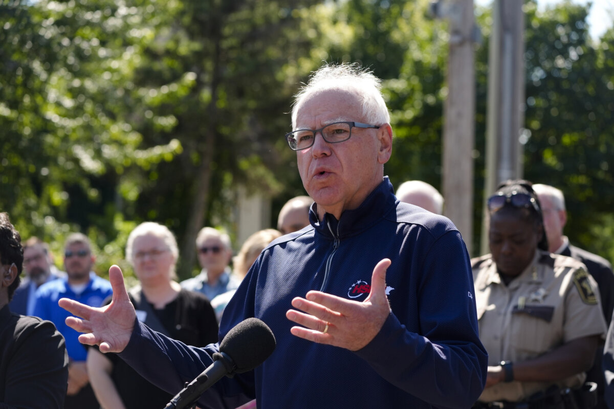 Minnesota Gov. Tim Walz speaks outside the Annunciation Catholic School, in Minneapolis on Aug. 27, 2025. (Bruce Kluckhohn/AP Photo)