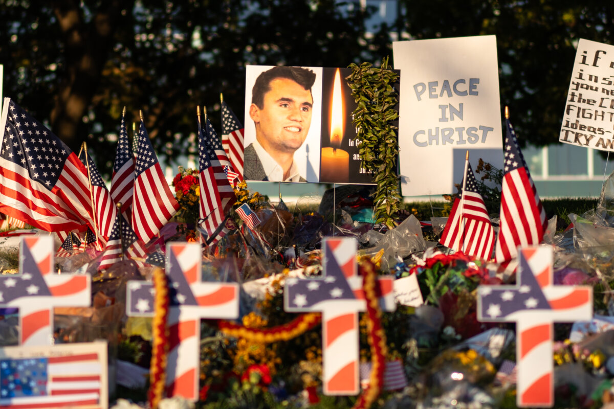 Flowers, American flags, and other items mourning Charlie Kirk at Utah Valley University in Orem, Utah, on Sept. 16, 2025. (Madalina Kilroy/The Epoch Times)