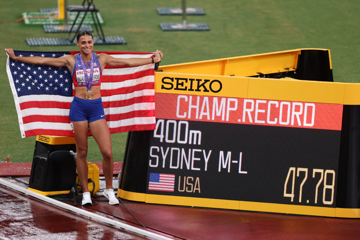Gold medalist Sydney McLaughlin-Levrone of Team United States poses for a photo beside a screen displaying her championship record time of 47.78 seconds in the Women's 400 Metres Final on day six of the World Athletics Championships Tokyo 2025 at National Stadium in Tokyo, Japan, on Sept. 18, 2025. (Emilee Chinn/Getty Images)