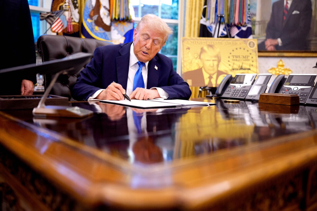 President Donald Trump signs an executive order in the Oval Office on Sept. 19, 2025. (Andrew Harnik/Getty Images)