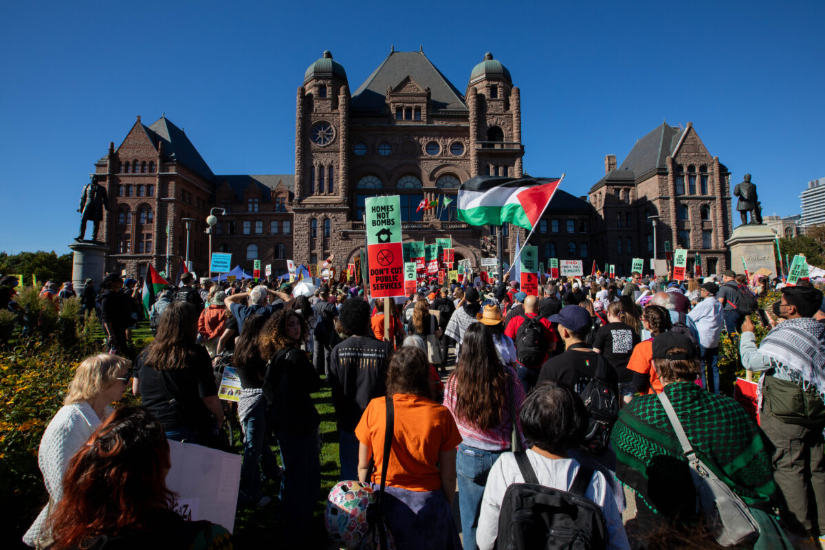 Protestors take part in a “Draw the Line” protest in Toronto on Sept. 20, 2025. (The Canadian Press/Alex Lupul)