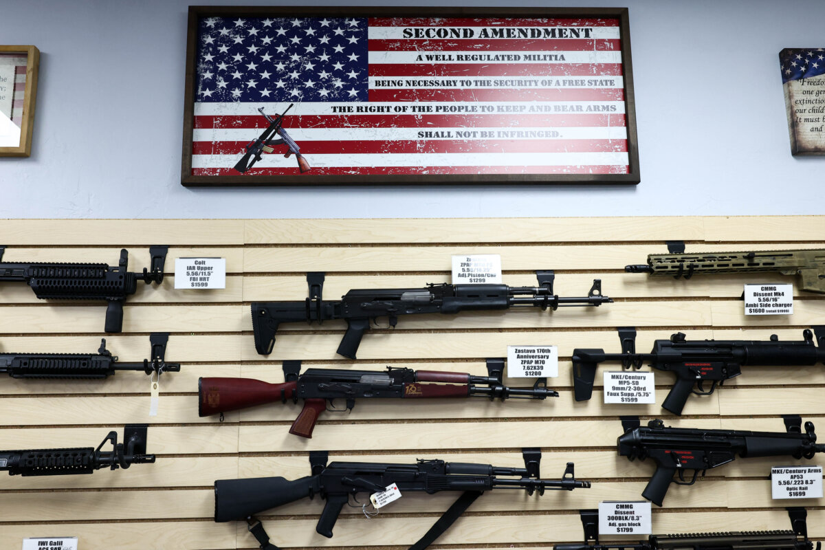 The Second Amendment is spelled on a U.S. flag above a display of firearms for sale in a gun store in Rio Rico, Santa Cruz County, Ariz., on Sept. 17, 2025. (Charly Triballeau/AFP via Getty Images)