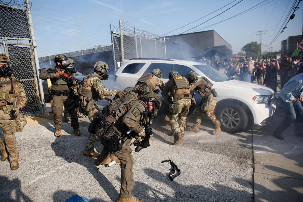 Federal law enforcement officers are confronted by anti-ICE demonstrators outside an Immigration and Customs Enforcement (ICE) processing center in Broadview, Ill., on Sept. 19, 2025. (Octavio Jones / AFP via Getty Images)
