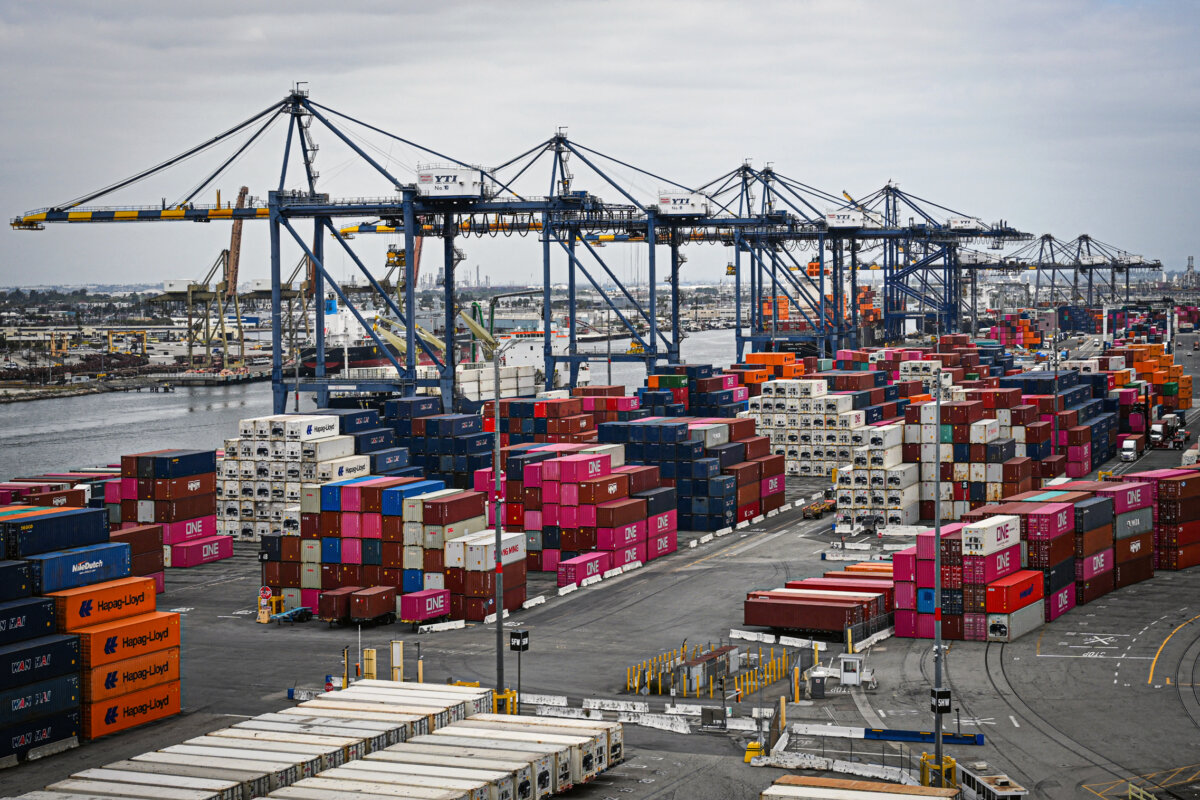 Shipping containers are stacked as cranes unload cargo ships at the Port of Los Angeles in San Pedro, Calif., on April 15, 2025. (Patrick T. Fallon/AFP via Getty Images)