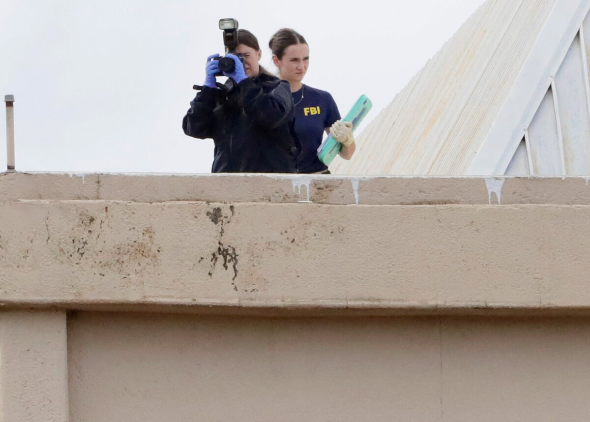 Members of the FBI investigate from the rooftop at 1120 Empire Central Place near the scene where a shooter opened fire on an Immigration and Customs Enforcement facility in Dallas on Sept. 24, 2025. (Stewart F. House/Getty Images)