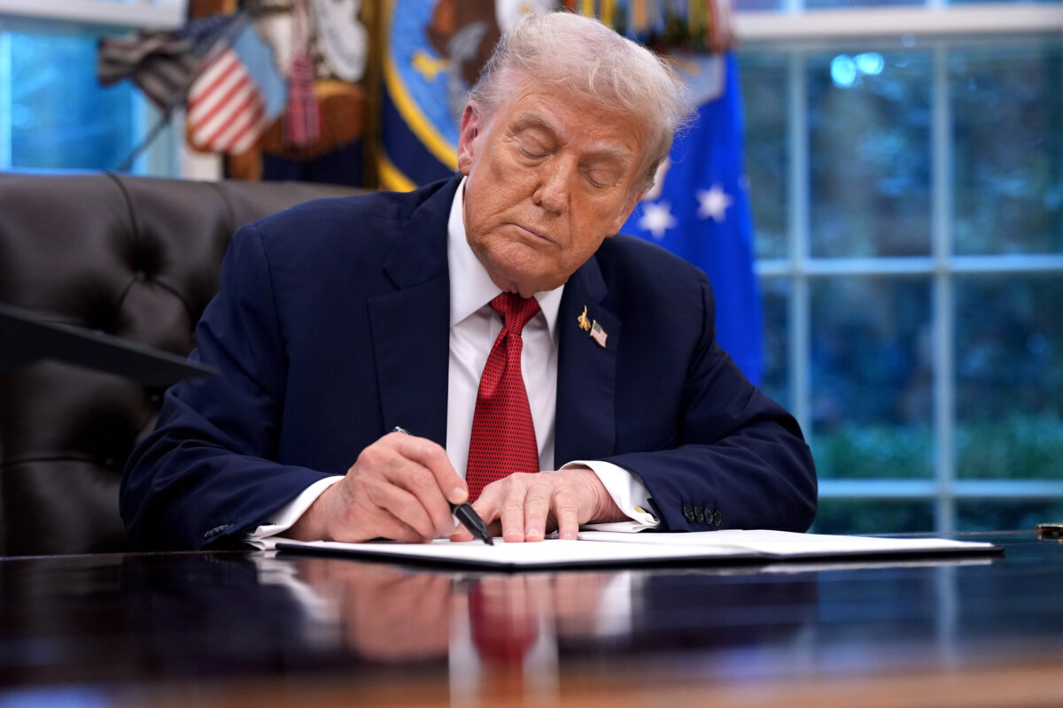 President Donald Trump holds signs an executive order in the Oval Office of the White House on September 25, 2025 in Washington, DC. (Andrew Harnik/Getty Images)