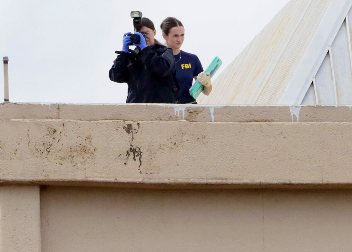 Members of the FBI investigate near the scene where a shooter opened fire on an Immigration and Customs Enforcement facility in Dallas, Texas, on Sept. 24, 2025. (Stewart F. House/Getty Images)