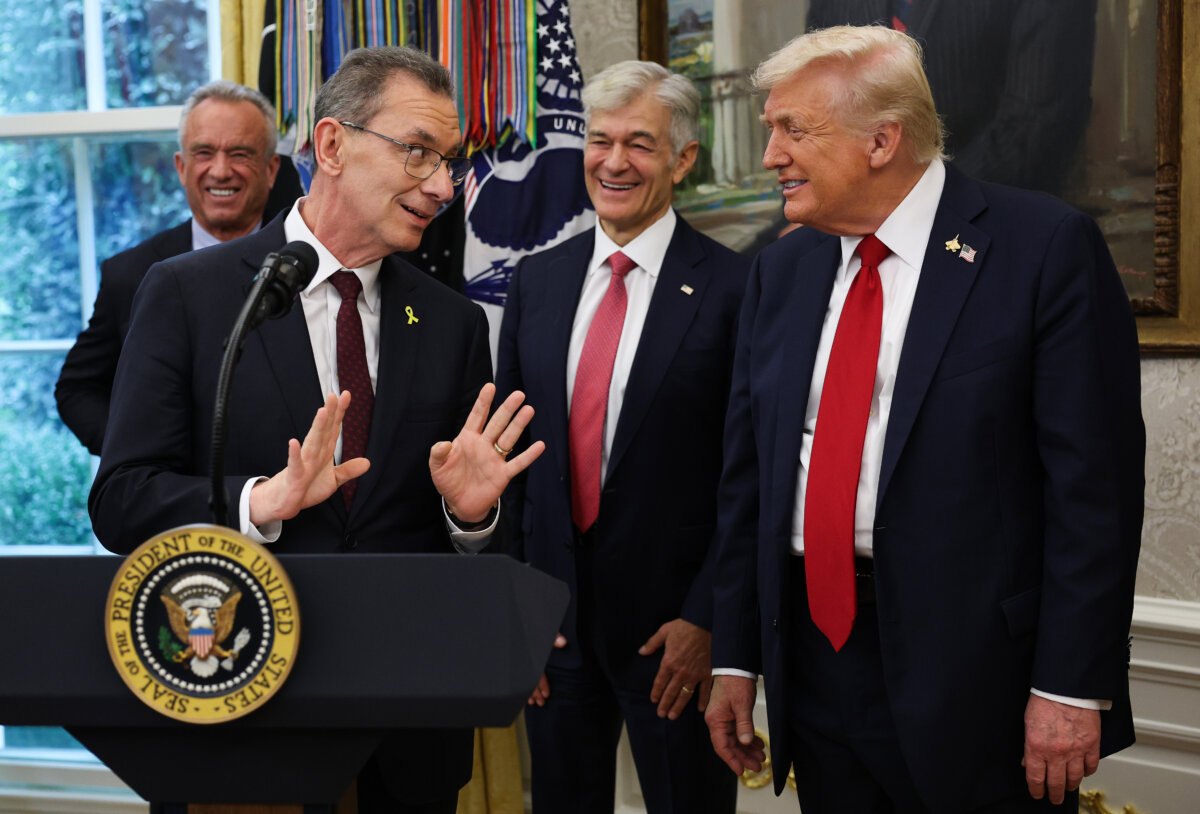 Pfizer CEO Albert Bourla speaks to President Donald Trump in Washington on Sept. 30, 2025. (Win McNamee/Getty Images)