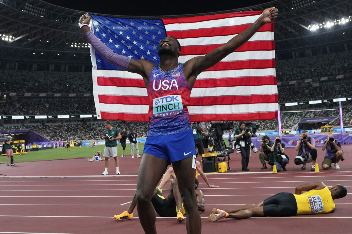 United States' Cordell Tinch celebrates after winning gold medal in men's 110 meters hurdles final at the World Athletics Championships in Tokyo, on Sept. 16, 2025. (Eugene Hoshiko/AP Photo)