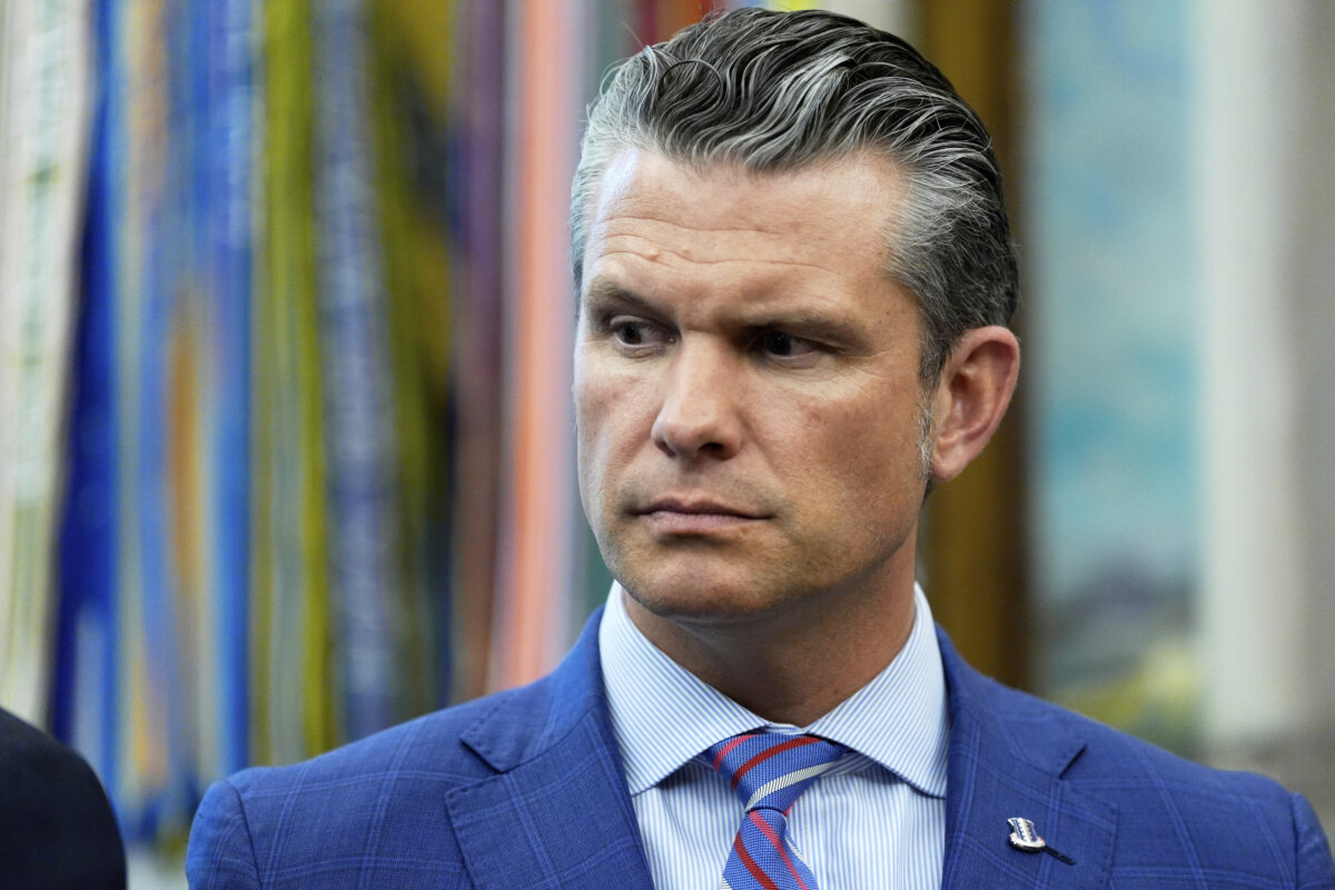 War Secretary Pete Hegseth listens as President Donald Trump speaks in the Oval Office on Sept. 15, 2025. (Alex Brandon/AP Photo)