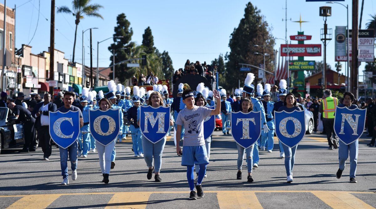 The Compton High School contingent leads the start of the 34th annual Kingdom Day Parade on Martin Luther King Jr Day, in Los Angeles, on Jan. 21, 2019. (Robyn Beck/AFP via Getty Images)