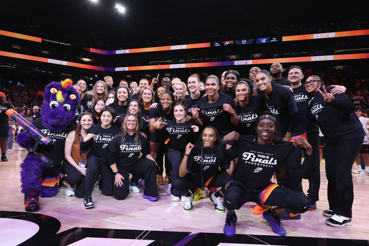 Phoenix Mercury players and coaches pose for a photo after defeating the Minnesota Lynx in the 2025 WNBA semifinals at PHX Arena in Phoenix on Sept. 28, 2025. (Christian Petersen/Getty Images)