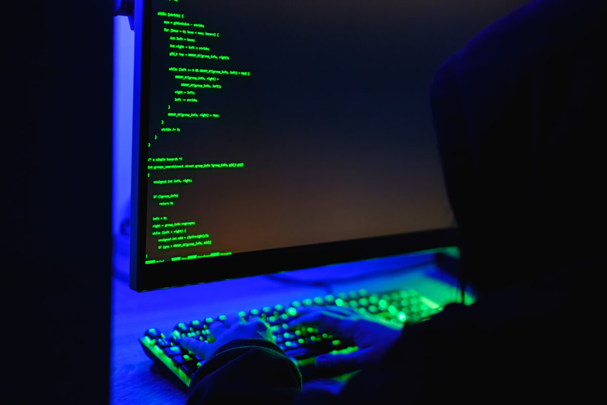 In this photo illustration, a hacker types on a computer keyboard on May 13, 2025. (Oleksii Pydsosonnii/The Epoch Times)
