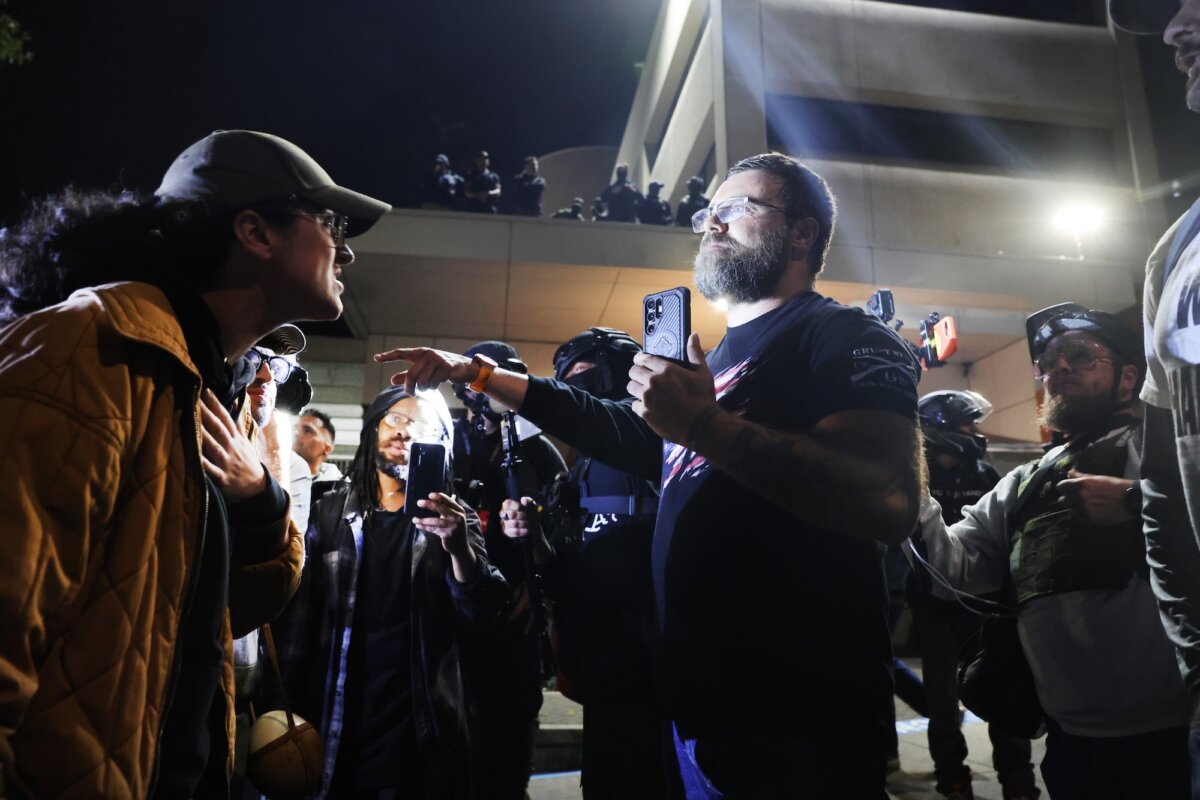 Protesters, both those supportive of Immigration and Customs Enforcement and those against it, meet outside of the Immigration and Customs Enforcement facility in Portland, Ore., on Oct. 3, 2025. (Spencer Platt/Getty Images)