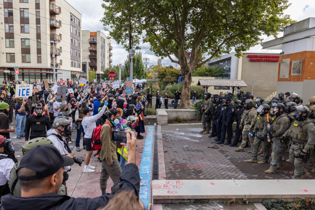 Protestors gather in front of Immigration and Customs Enforcement offices in Portland, Ore., on Oct. 4, 2025. (John Fredricks/The Epoch Times)