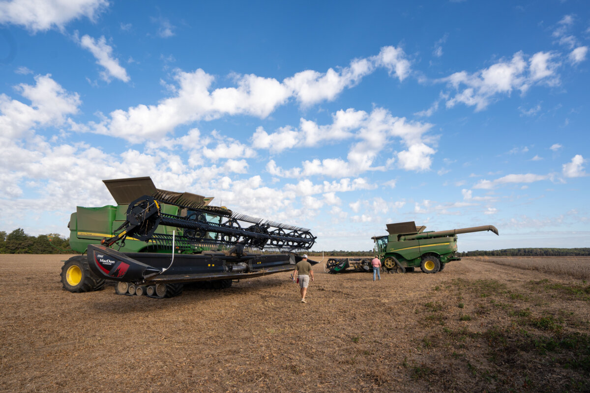 Combines next to a soybean field in Tallahatchie County, Miss., on Oct. 4, 2025. (Samira Bouaou/The Epoch Times)