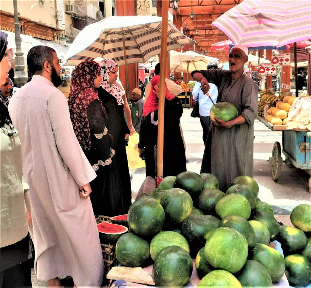 "Slow traveling" provides opportunities to meet local residents, such as these people at a market in Cairo, Egypt. (Victor Block)