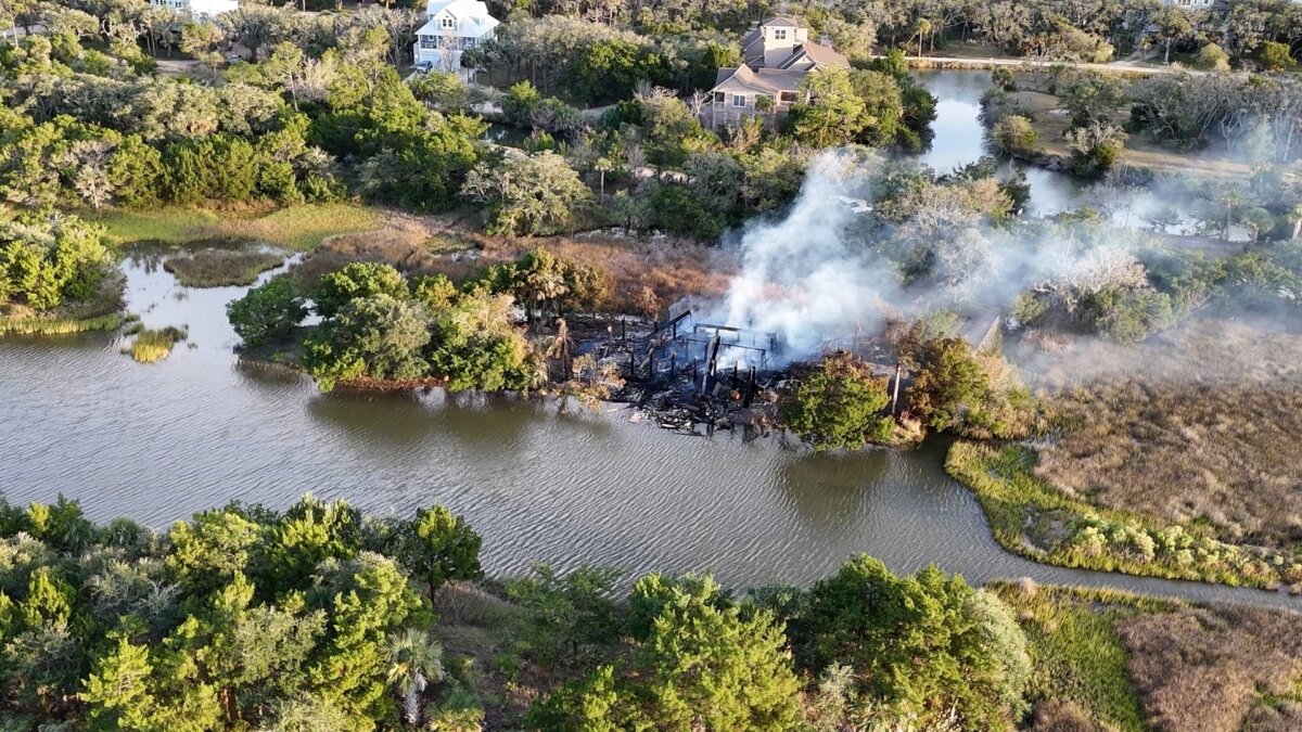 Smoke rises from a house fire on Edisto Island, S.C., on Oct. 4, 2025. (WCBD via AP)