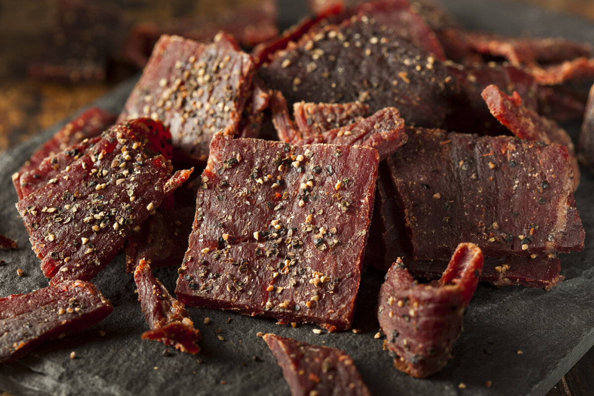 Homemade beef jerky is marinated in a blend of spices and dried in an oven. (Brent Hofacker/Shutterstock)