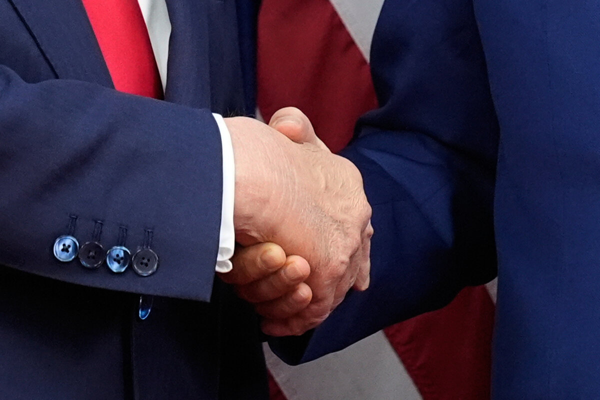 President Donald Trump (left) and Chinese leader Xi Jinping shake hands before their meeting at Gimhae International Airport in Busan, South Korea, on Oct. 30, 2025. (Mark Schiefelbein/AP Photo)
