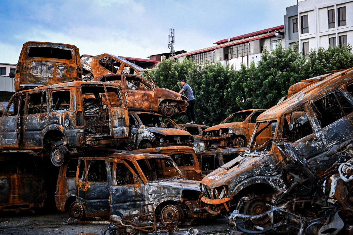 Charred vehicles are piled in a heap inside the torched parliament building complex after protests in Kathmandu, Nepal, on Oct. 8, 2025. (Prakash Mathema/AFP via Getty Images)