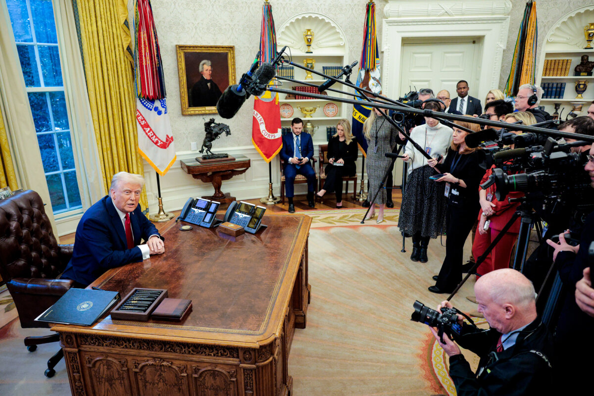 President Donald Trump talks to reporters from the Resolute Desk after signing an executive order in the Oval Office on Jan. 30, 2025. (Chip Somodevilla/Getty Images)