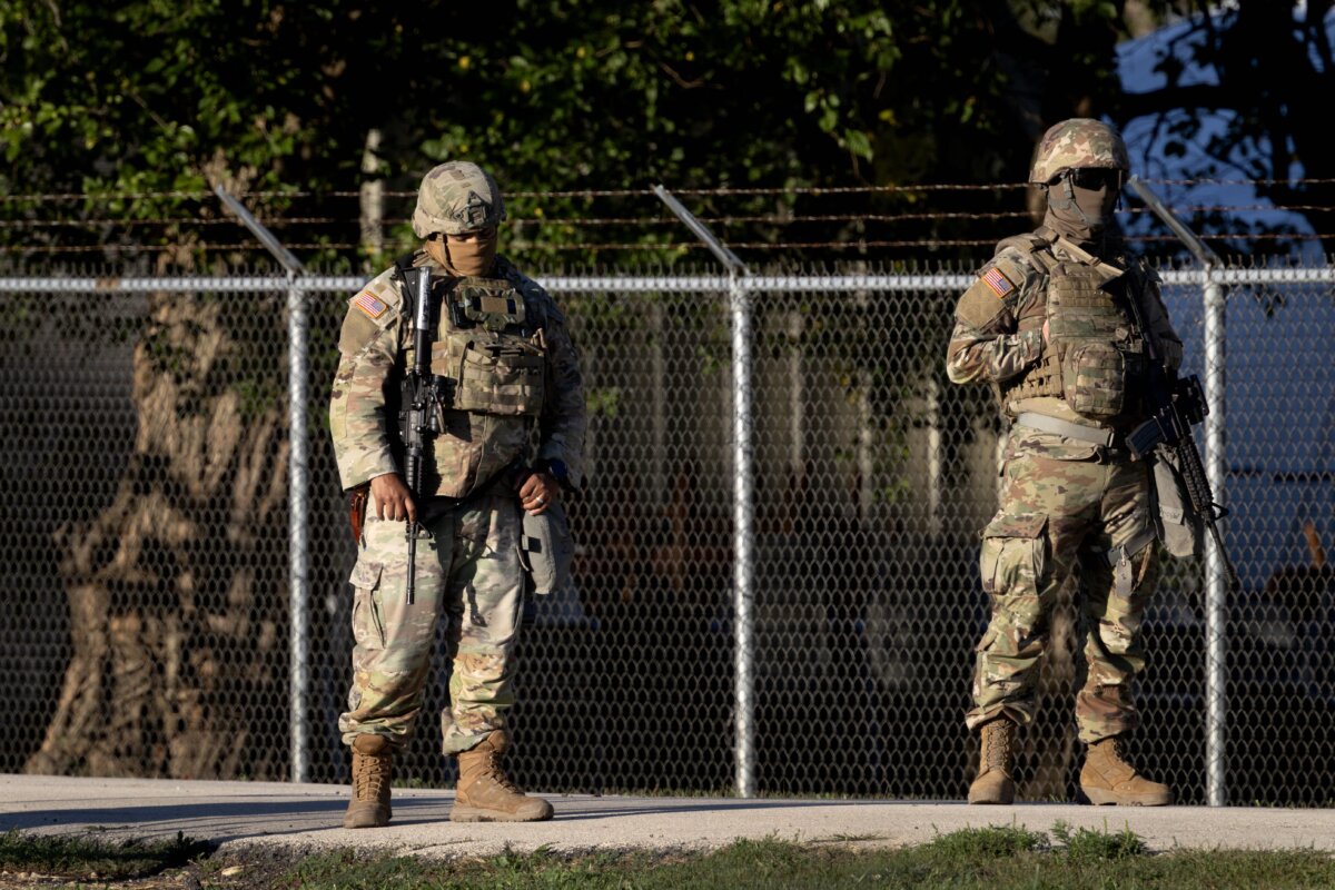 Members of the Texas National Guard stand guard at an Army Reserve training facility in Elwood, Ill., on Oct. 7, 2025. (Scott Olson/Getty Images)