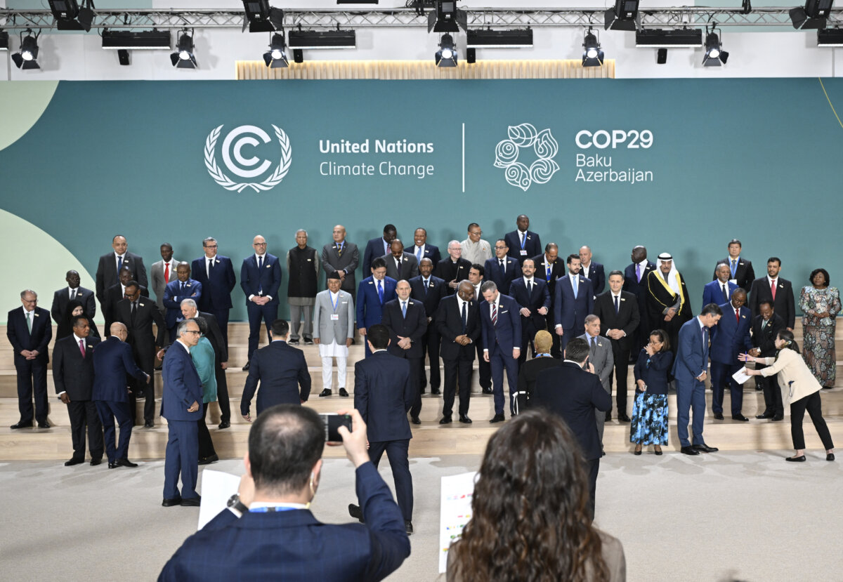 Participating world leaders and delegates arrive for a family photo during the United Nations Climate Change Conference (COP29) in Baku, Azerbaijan, on Nov. 12, 2024. (Alexander Nemenov/AFP via Getty Images)