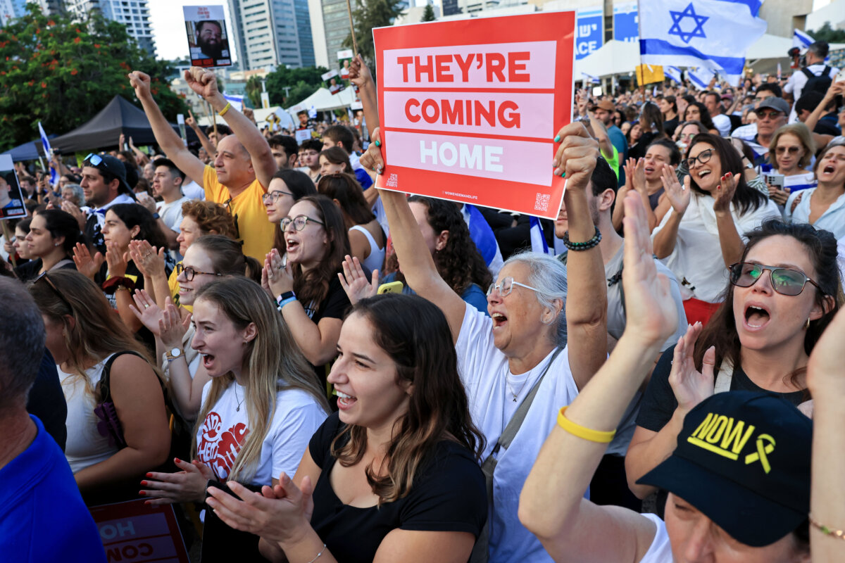 People watch the hostage release live stream at Hostages Square in Tel Aviv, Israel, on Oct. 13, 2025. (Photo by Chris McGrath/Getty Images)