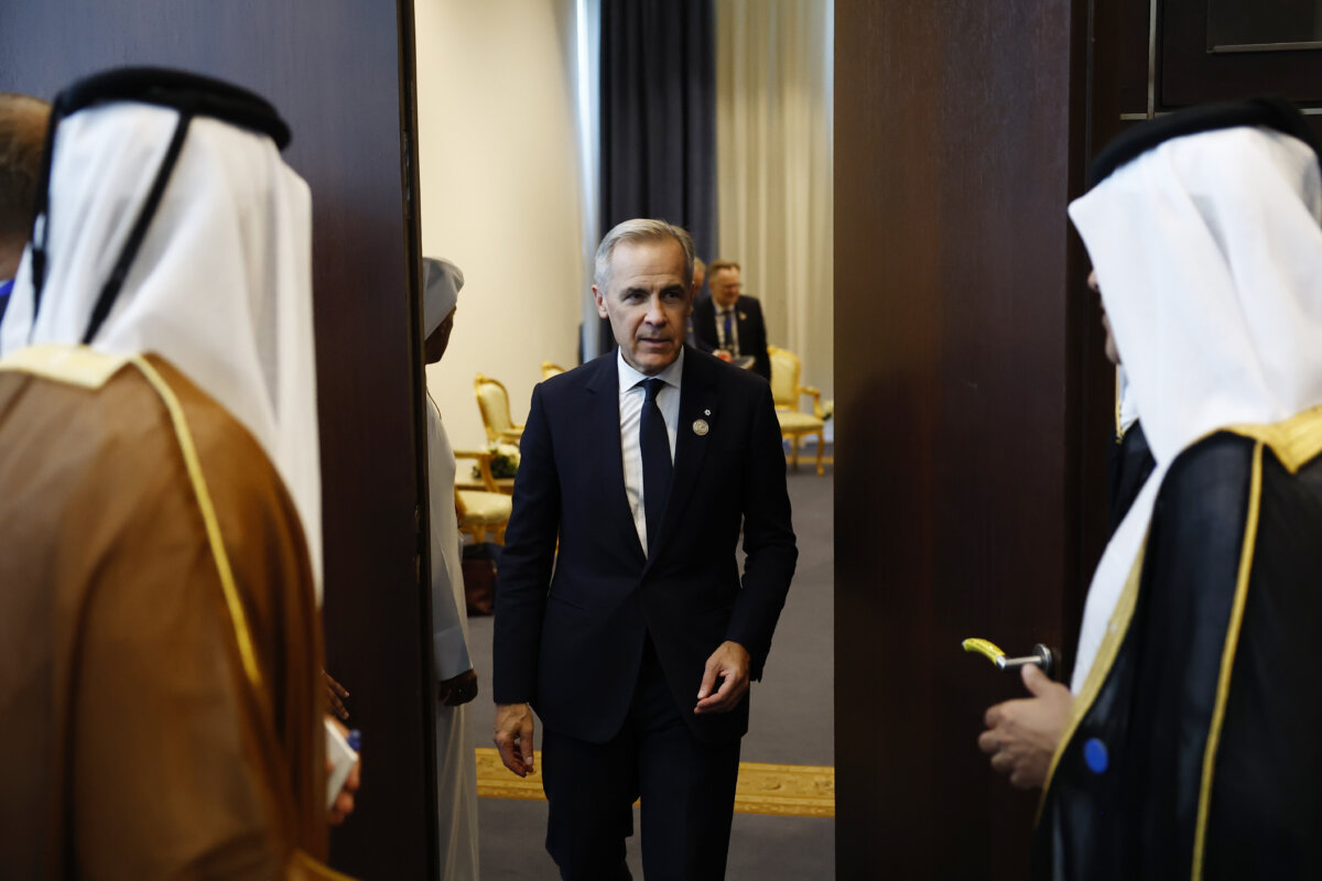Prime Minister Mark Carney leaves a bilateral meeting with Emir of Qatar Cheikh Tamim ben Hamad al-Thani at the Gaza International Peace Summit, in Sharm el-Sheikh, Egypt, on Oct. 13, 2025. (Yoan Valat, Pool photo via AP)