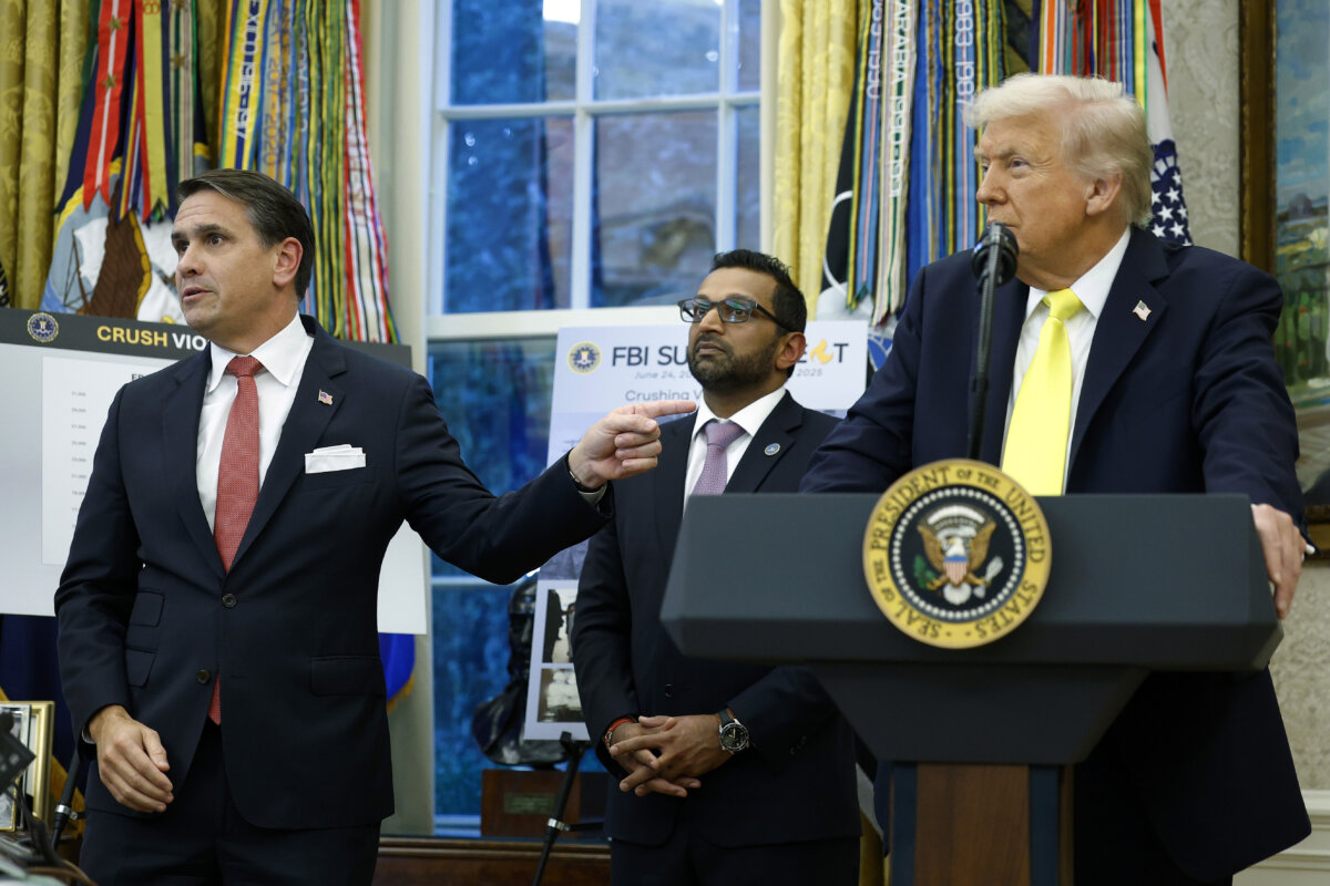 Deputy Attorney General Todd Blanche (L) gestures to President Donald Trump as he speaks during a press conference in the Oval Office of the White House on Oct. 15, 2025. (Kevin Dietsch/Getty Images)