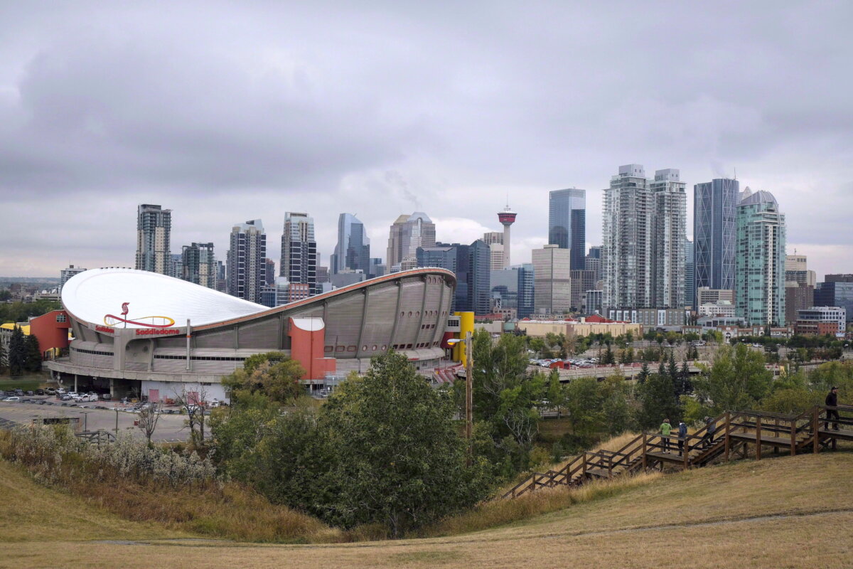 The Calgary skyline, with the Scotiabank Saddledome in the forefront, in a file photo. (The Canadian Press/Jeff McIntosh)