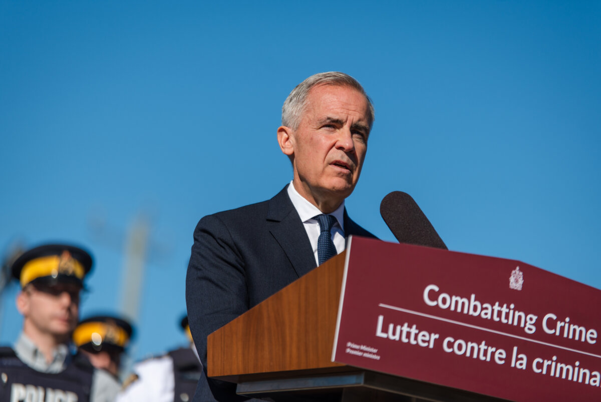 Prime Minister Mark Carney makes an announcement at an RCMP detachment in Etobicoke, Ont., on Oct. 16, 2025. (The Canadian Press/Laura Proctor)