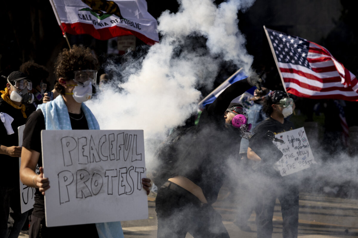Clashes between protesters and law enforcement erupted after authorities declared an unlawful assembly during the "No Kings" protest against the Trump administration in Los Angeles on June 14, 2025. (ETIENNE LAURENT/AFP via Getty Images)