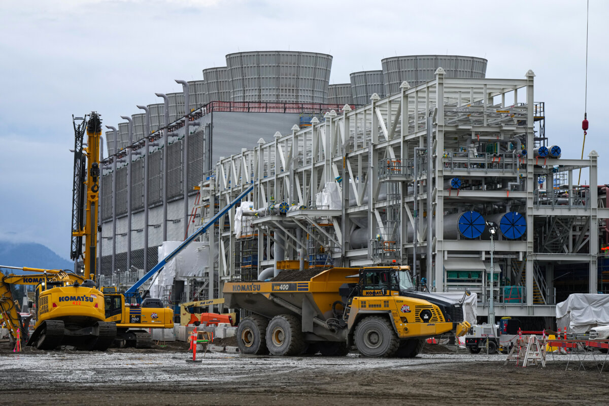 Cooling towers used to dissipate heat generated when natural gas is converted into liquefied natural gas under construction at the LNG Canada export terminal in Kitimat, B.C., on Sept. 28, 2022. (The Canadian Press/Darryl Dyck)