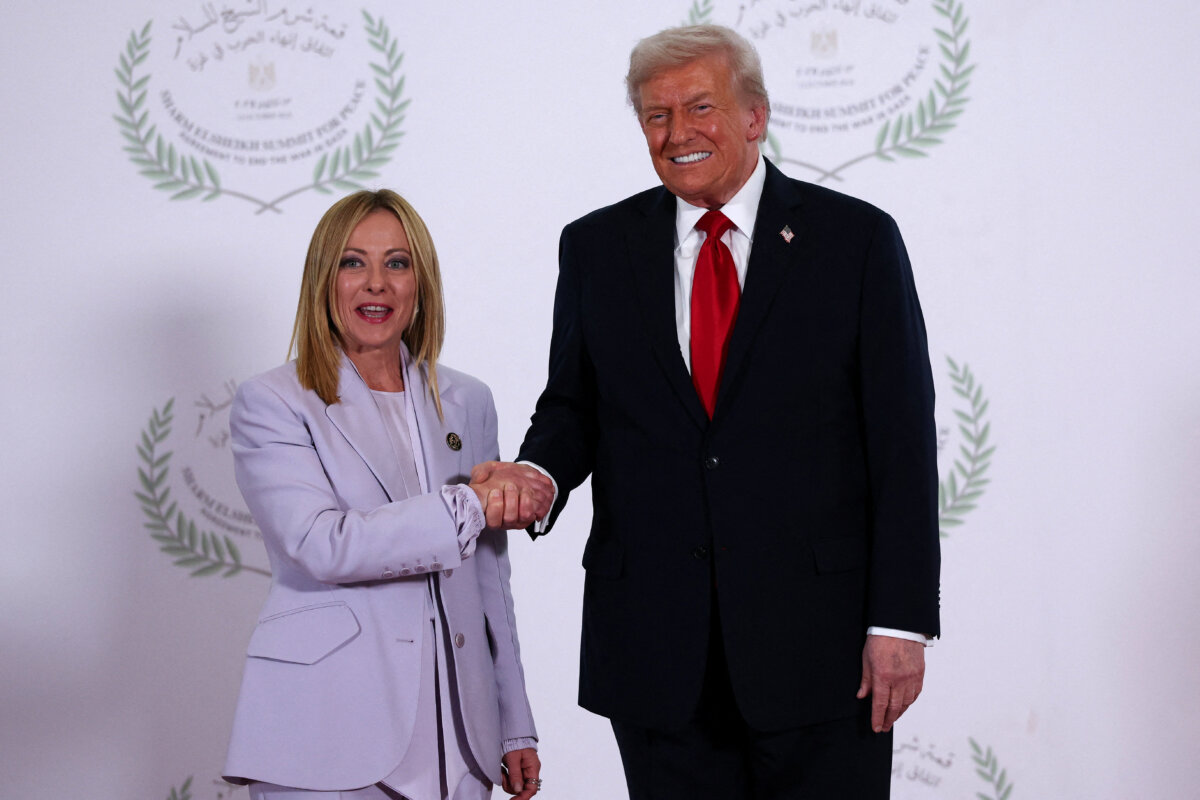 President Donald Trump and Italian Prime Minister Giorgia Meloni shake hands as they pose for a photo, at a world leaders' summit in Sharm El-Sheikh, Egypt, on Oct. 13, 2025. (Suzanne Plunkett - Pool/Getty Images)